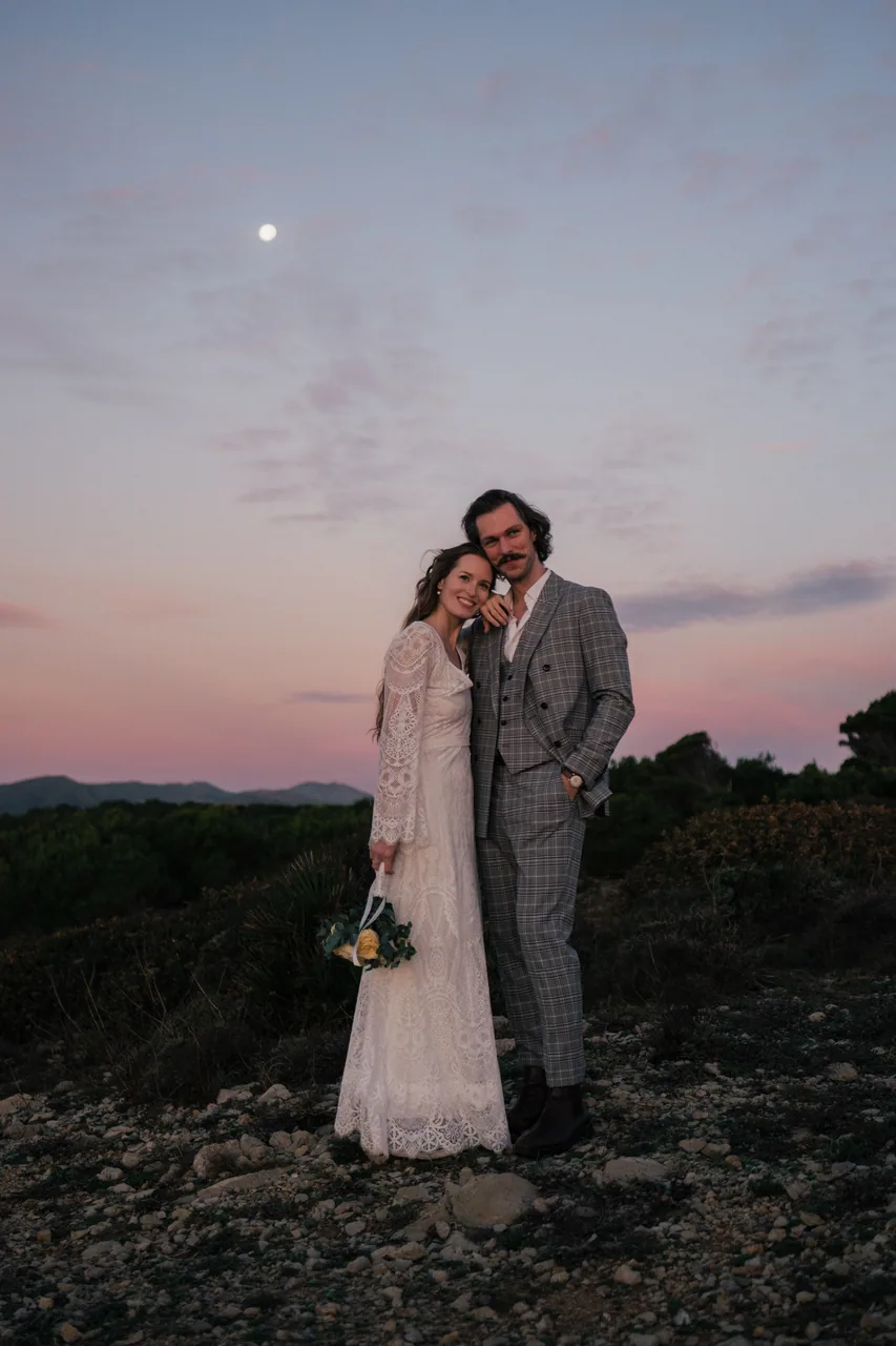 A couple by the Mallorcan coast at sunset