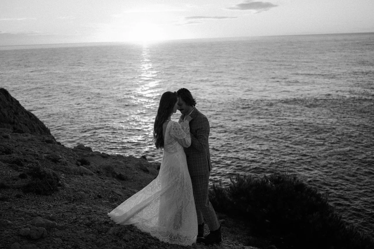 A couple by the sea at sunset on Mallorca