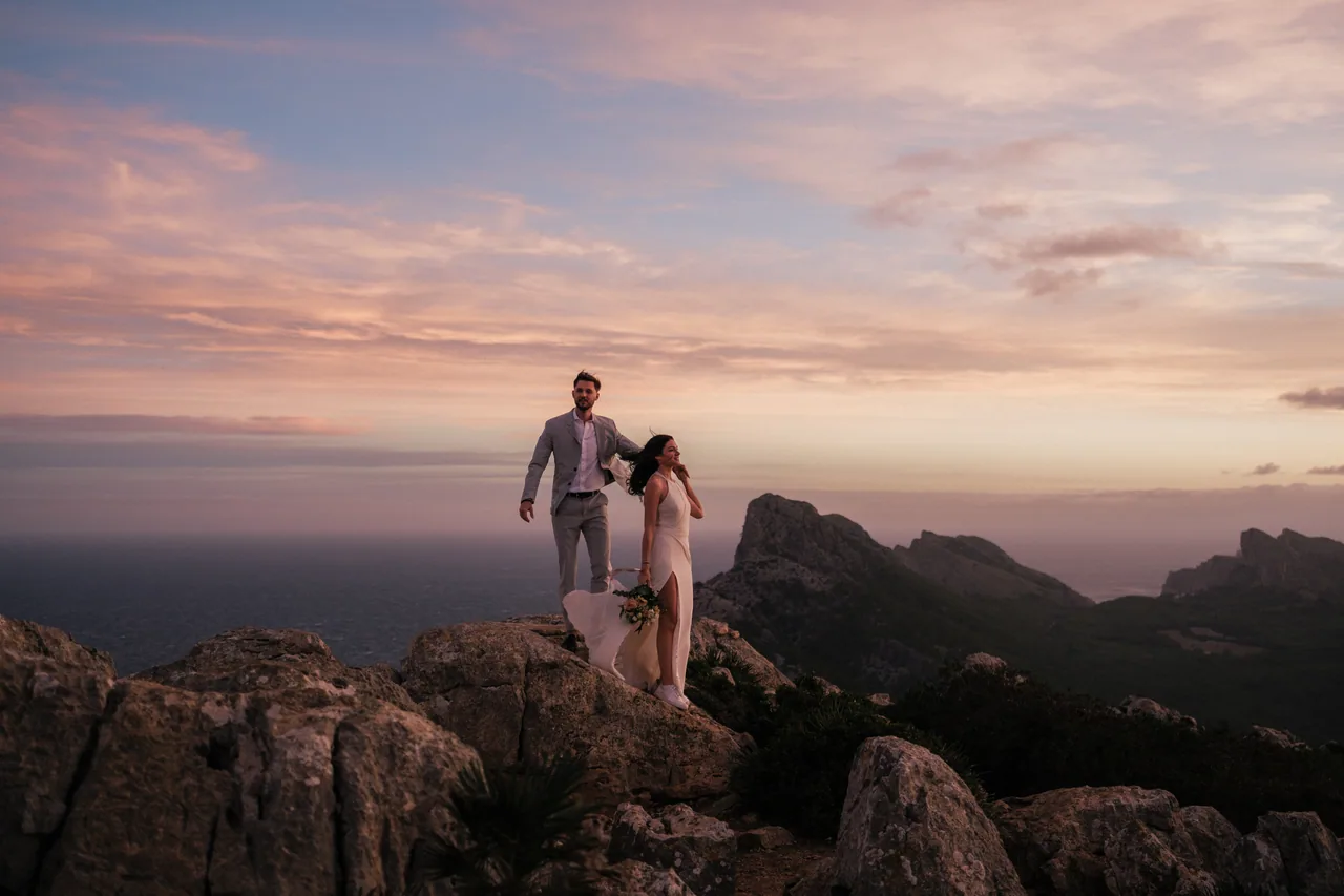 A couple on a rocky Tramuntana ridge at sunset, Mallorca